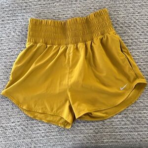 Nike Women's Mustard Yellow Smocked-Waist Running Shorts